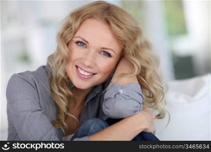 Portrait of beautiful blond woman relaxing at home