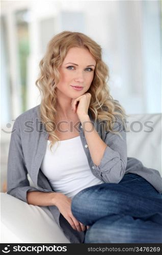 Portrait of beautiful blond woman relaxing at home