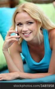 Portrait of beautiful blond woman using cellphone