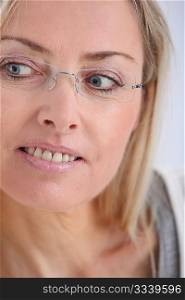 Portrait of beautiful blond woman with eyeglasses