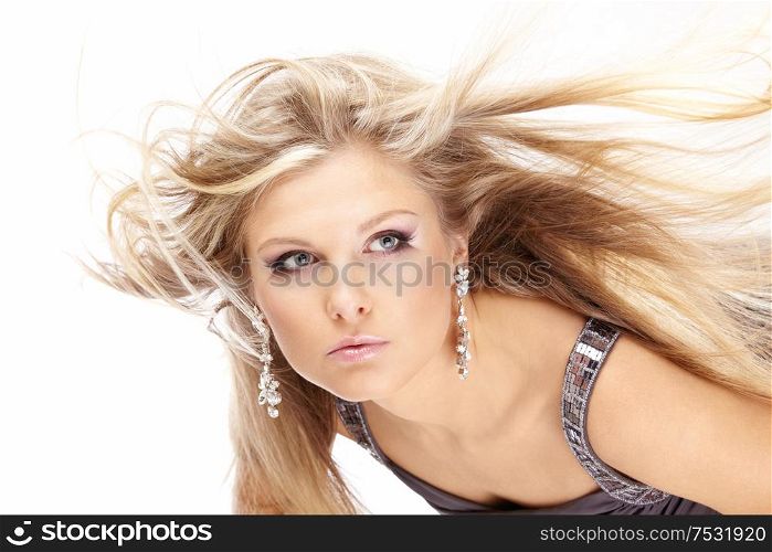 Portrait of beautiful blonde with the flying hair, isolated