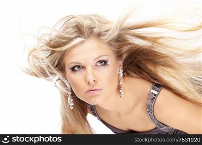 Portrait of beautiful blonde with the flying hair, isolated