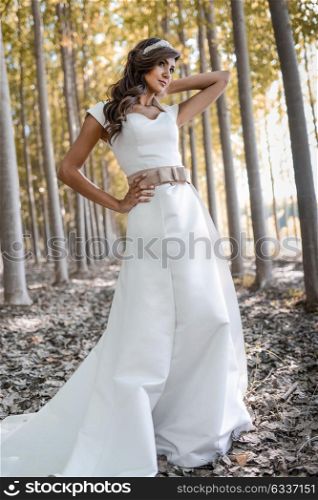 Portrait of beautiful bride outdoors in a forest