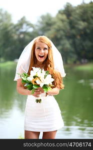 Portrait of beautiful bride with flowers