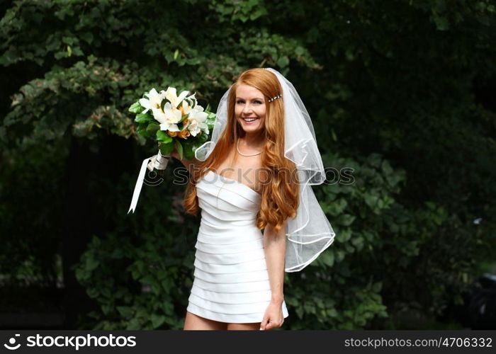 Portrait of beautiful bride with flowers