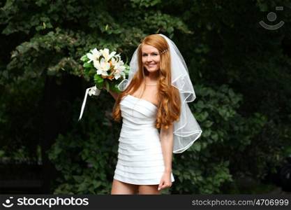 Portrait of beautiful bride with flowers