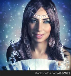 Portrait of beautiful brunet woman wearing stylish jewelery over dark snowy background, gorgeous snow queen, fashionable look for Christmas party