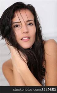 Portrait of beautiful brunette with wet hair