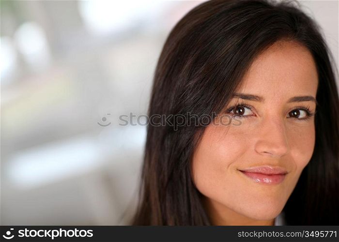 Portrait of beautiful brunette woman relaxing at home