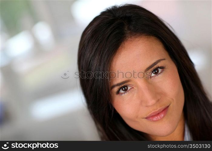 Portrait of beautiful brunette woman relaxing at home