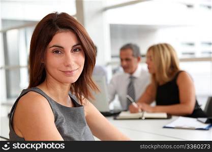 Portrait of beautiful businesswoman in work meeting