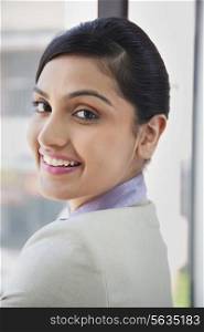 Portrait of beautiful businesswoman smiling while looking at camera