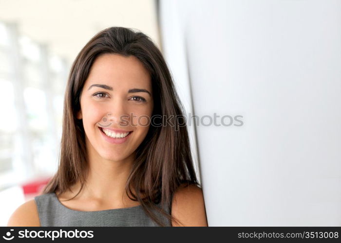 Portrait of beautiful businesswoman standing in hall