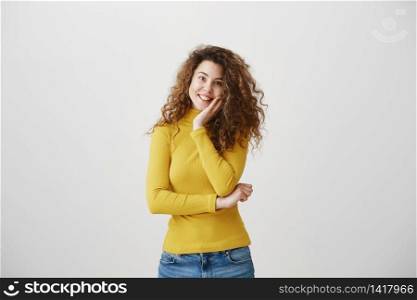 Portrait of beautiful cheerful redhead girl with curly hair smiling laughing looking at camera over white background. Portrait of beautiful cheerful redhead girl with curly hair smiling laughing looking at camera over white background.