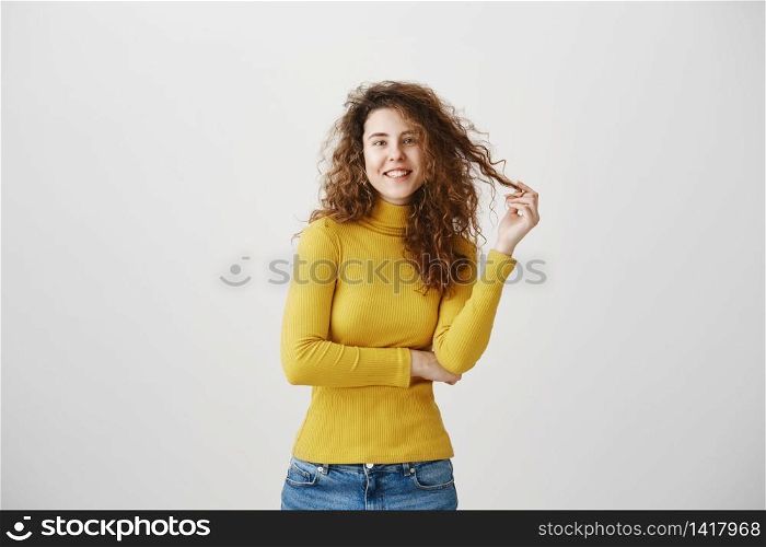 Portrait of beautiful cheerful redhead girl with curly hair smiling laughing looking at camera over white background. Portrait of beautiful cheerful redhead girl with curly hair smiling laughing looking at camera over white background.