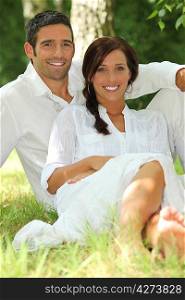 portrait of beautiful couple dressed in white