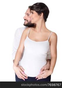 Portrait of beautiful couple waiting baby posing in the studio, looking in side isolated on white background, happy young family, enjoying pregnancy