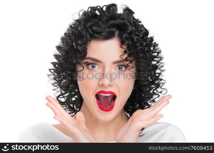 Portrait of beautiful curly hair brunette girl isolated on white background. Surprised emotional face, open mouth.. Surprised woman on white