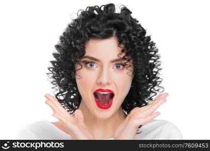 Portrait of beautiful curly hair brunette girl isolated on white background. Surprised emotional face, open mouth.. Surprised woman on white