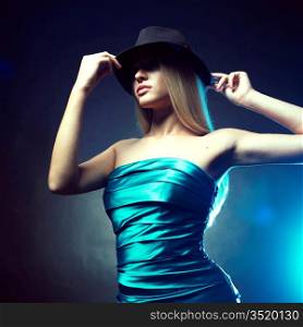Portrait of beautiful dancing girl in hat