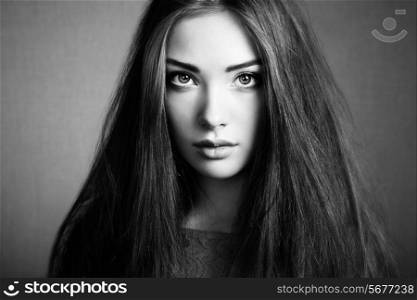 Portrait of beautiful dark-haired woman close up. Beauty photo. Black and white