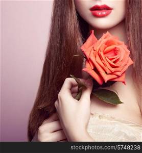 Portrait of beautiful dark-haired woman with flowers. Perfect makeup. Brunette girl. Fashion photo