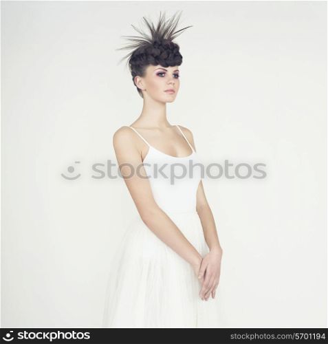 Portrait of beautiful elegant ballerina on white background