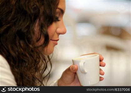 Portrait of beautiful elegant woman with coffee cup