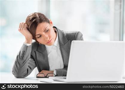Portrait of beautiful executive working on computer at office