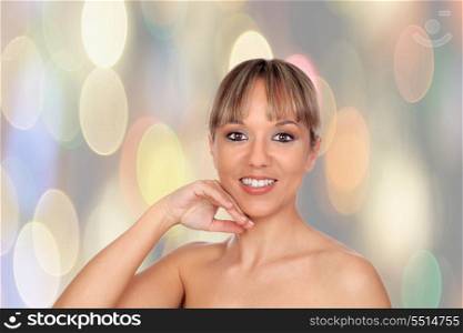 Portrait of beautiful female model with a sparkle background