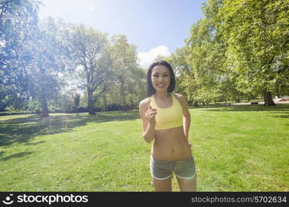 Portrait of beautiful fit woman jogging at park