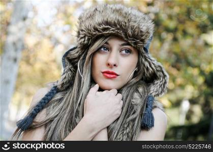 Portrait of beautiful girl with the winter hat on