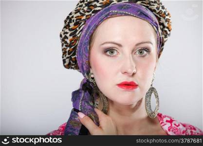 portrait of beautiful girl woman in a turban fashion photo gray background
