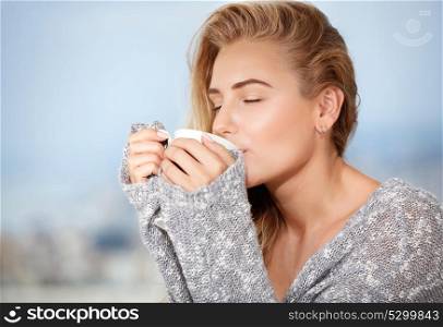 Portrait of beautiful happy sensual girl with closed eyes enjoying tasty strong morning coffee, having breakfast in outdoors cafe