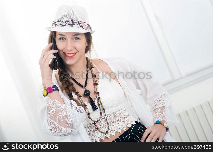 portrait of beautiful hippie girl with a smartphone