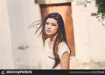 Portrait of beautiful japanese woman in urban background