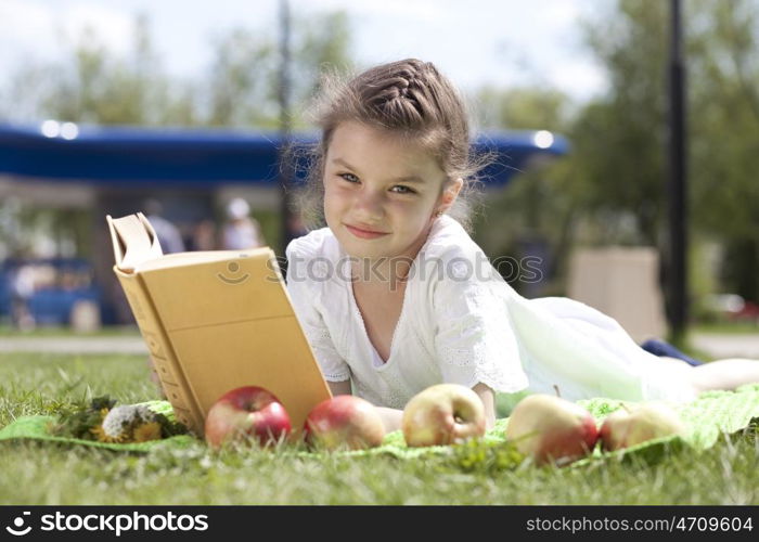 Portrait of beautiful little girl in spring blossom