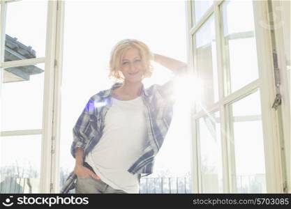 Portrait of beautiful mid-adult woman at home