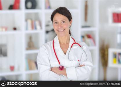 portrait of beautiful middle aged female doctor smiling