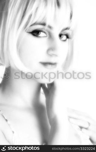 Portrait of beautiful Middle Eastern woman in black and white with blonde hair.