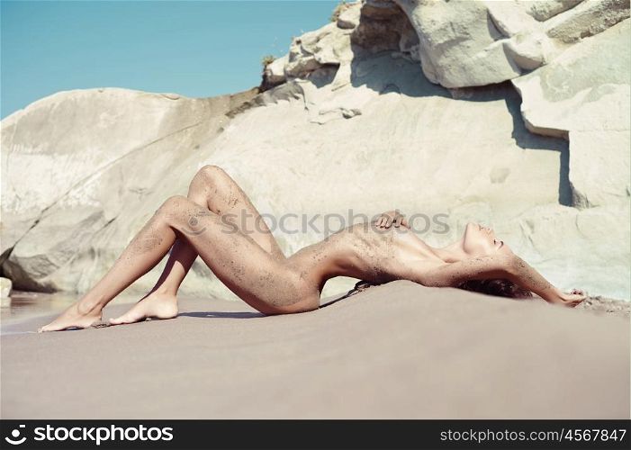 Portrait of beautiful nude blonde on the nudist beach