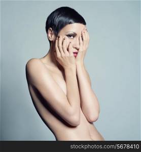 Portrait of beautiful nude lady with short hair