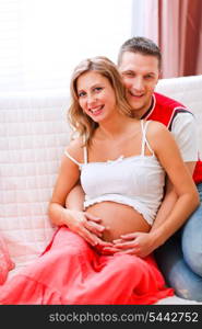 Portrait of beautiful pregnant woman and her husband&#xA;