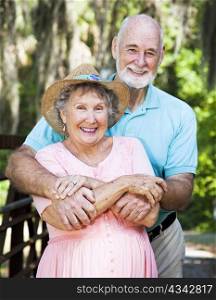 Portrait of beautiful senior couple in natural outdoor setting.