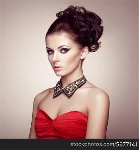 Portrait of beautiful sensual woman with elegant hairstyle. Diamond collar. Perfect makeup. Fashion photo