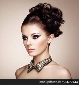 Portrait of beautiful sensual woman with elegant hairstyle. Diamond collar. Perfect makeup. Fashion photo