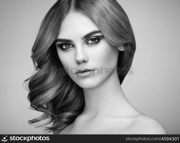 Portrait of beautiful sensual woman with elegant hairstyle. Perfect makeup. Beauty fashion. Eyelashes. Lips. Cosmetic Eyeshadow. Black and White