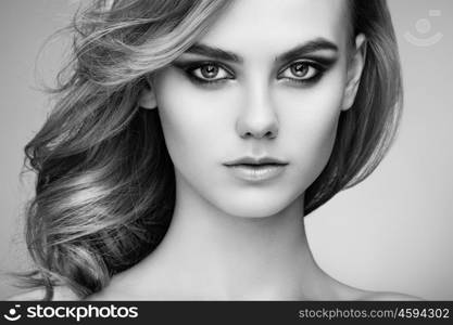 Portrait of beautiful sensual woman with elegant hairstyle. Perfect makeup. Beauty fashion. Eyelashes. Lips. Cosmetic Eyeshadow. Black and White