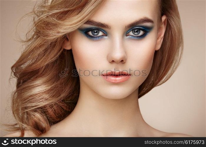 Portrait of beautiful sensual woman with elegant hairstyle. Perfect makeup. Beauty fashion. Eyelashes. Lips. Cosmetic Eyeshadow
