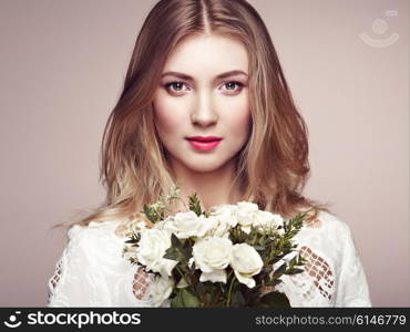 Portrait of beautiful sensual woman with elegant hairstyle. Perfect makeup. Blonde girl. Beauty fashion. Flowers